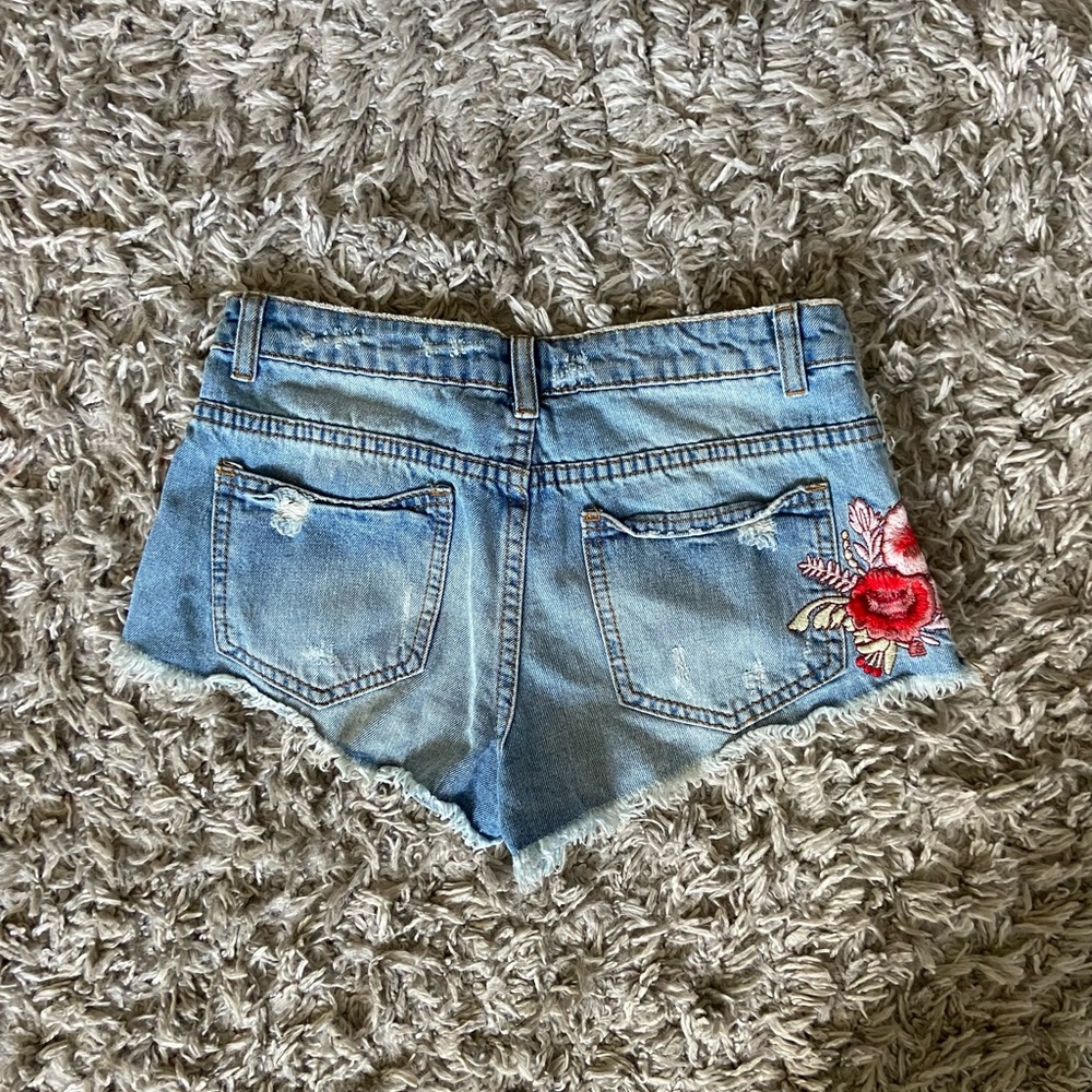 Embroidered mid waisted jean shorts